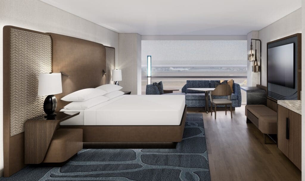 A comfortable king-sized bed, TV and seating area, with a view of DFW Airport, are part of the Grand Hyatt DFW renovation. (Photo courtesy of Grand Hyatt DFW)