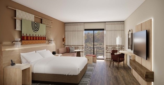 A king bed guest room at the Hyatt Regency Tamaya showing bed, TV and desk.