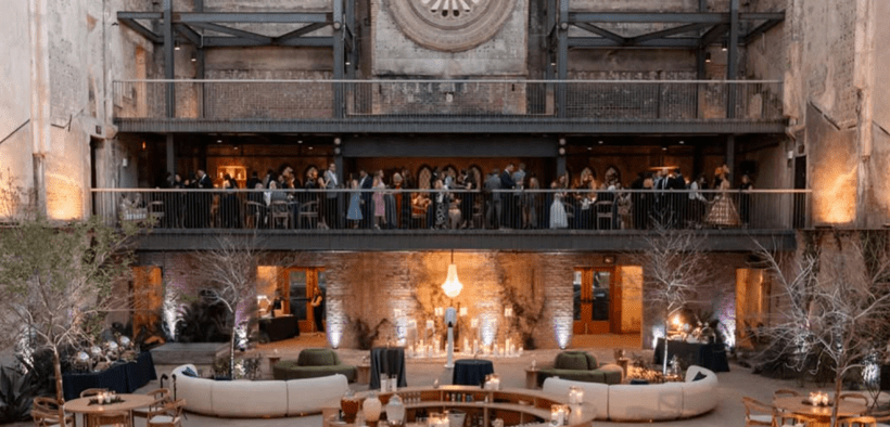 The Monroe Street Abbey in Phoenix with a firepit feature and several tables set for a Steve Short Culinary event.