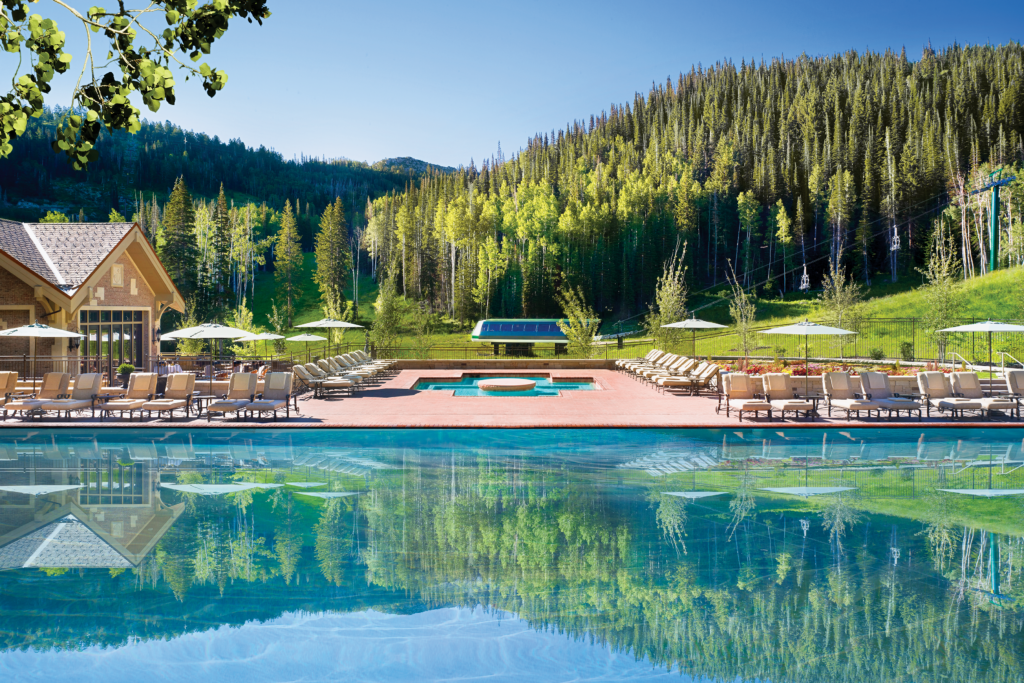 Montage Deer Valley’s outdoor pool and hot tub are surrounded by the forest.