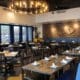 An interior photo of Patricia's Pizza in Scottsdale with booth and center tables.