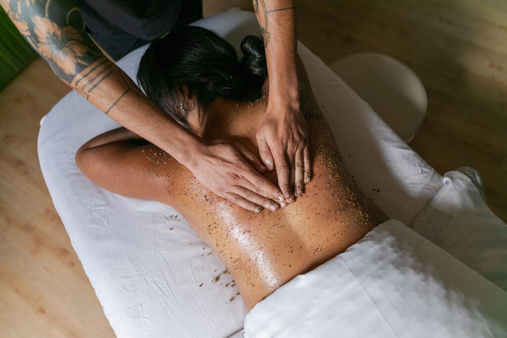 Woman gets a spa scrub treatment on her back at Spa Brezza, San Diego Mission Bay Resort