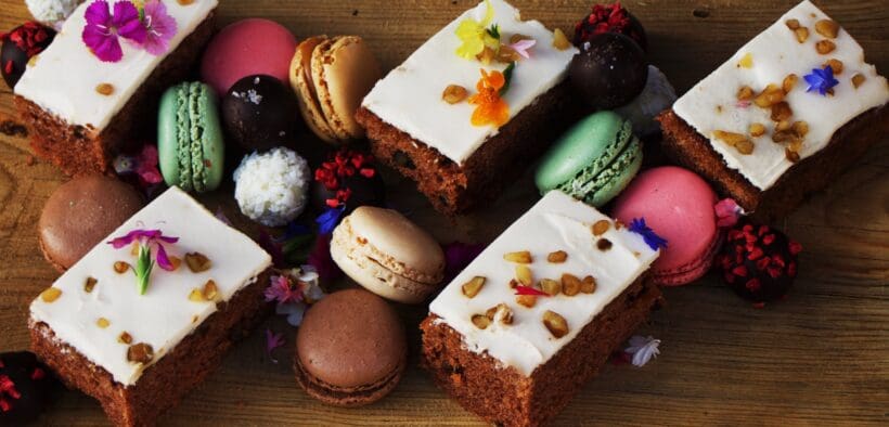 An assortment of Mother's Day cakes and macarons on a tray from the Urban Farmer.