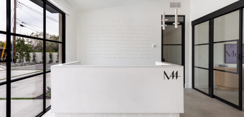 The Med 44 lobby with desk and conference room.