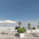 Artist rendering of Bay Shores Peninsula Hotel at Newport Beach with rooftop seating and umbrellas.