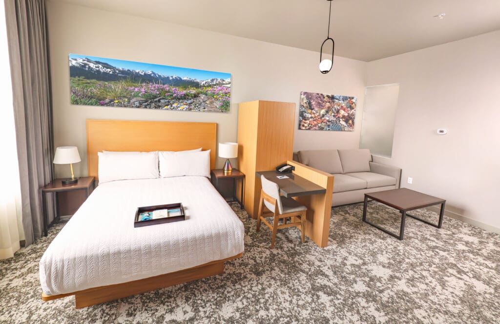 A newly rennovated room with a king-size bed and seating area at The Springs Resort in Pagosa Springs, CO.