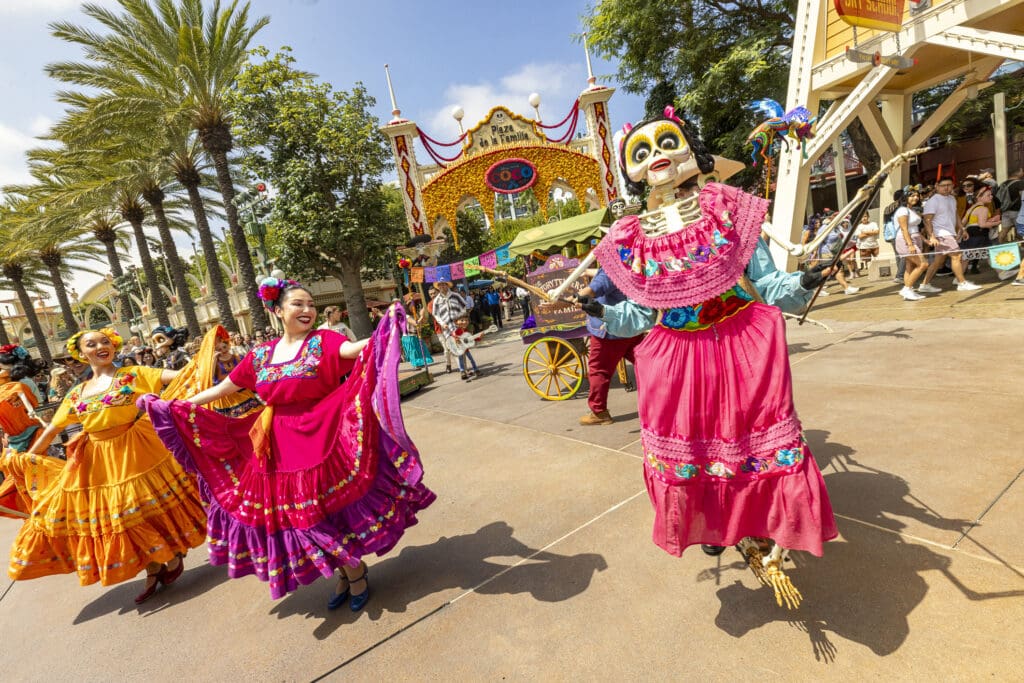 Festive dancers and puppets dance at Plaza de la Familia at Disney California Adventure Park to celebrate Día de los Muertos inspired by Disney and Pixar’s “Coco.”