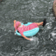 Santa in pajamas on a donut floatie, cruising down the Hyatt Regency Hill Country Resort lazy river.