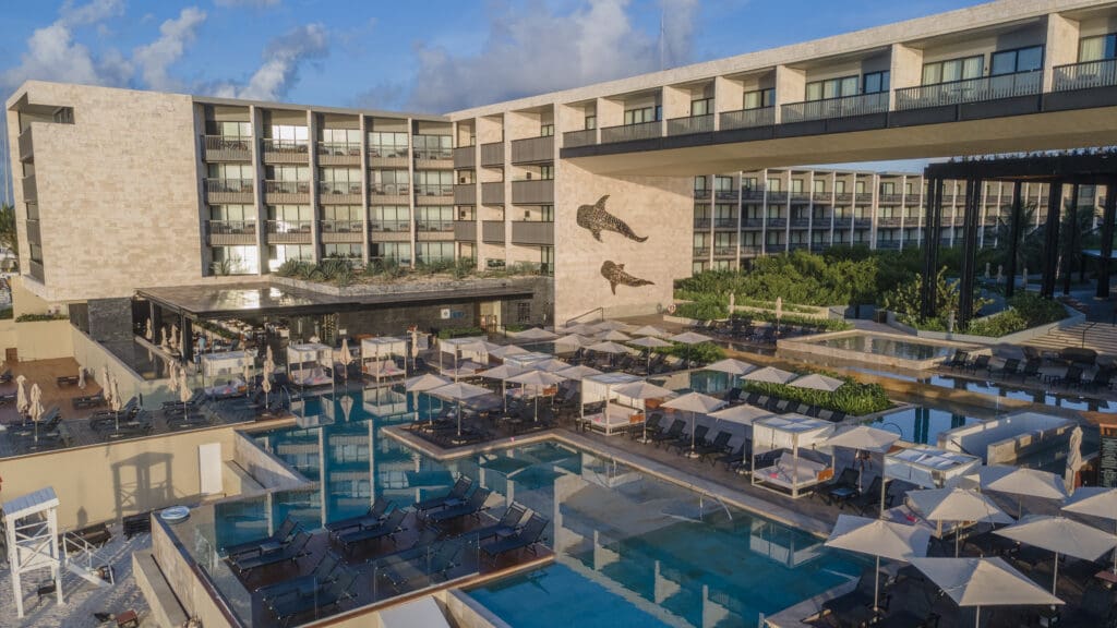 Devossion by Live Aqua adults-only hotel high rise and courtyard pools with cabanas in Playa del Carmen.