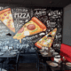 A painted mural of pizza slices at Lorenzo's Italian Kitchen.