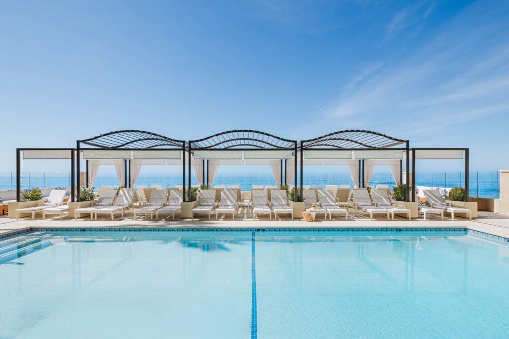Surf & Sand, Laguna Beach pool with cabanas, lounge chairs and a view of the Pacific Ocean.