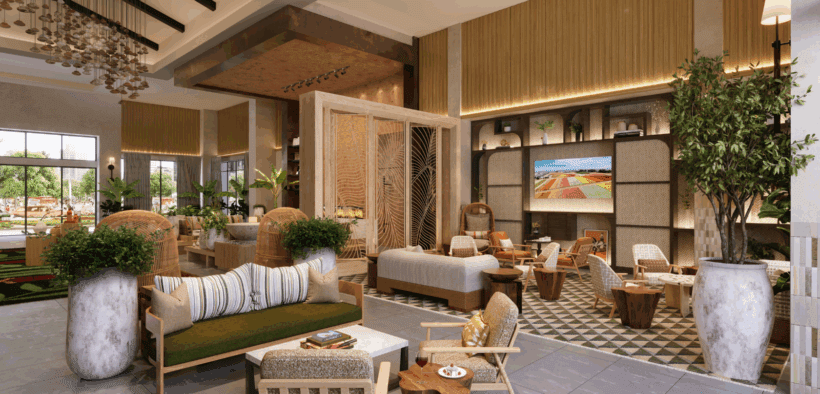 The updated lobby of Hotel Solea with a couch, plants and light-wood accents.