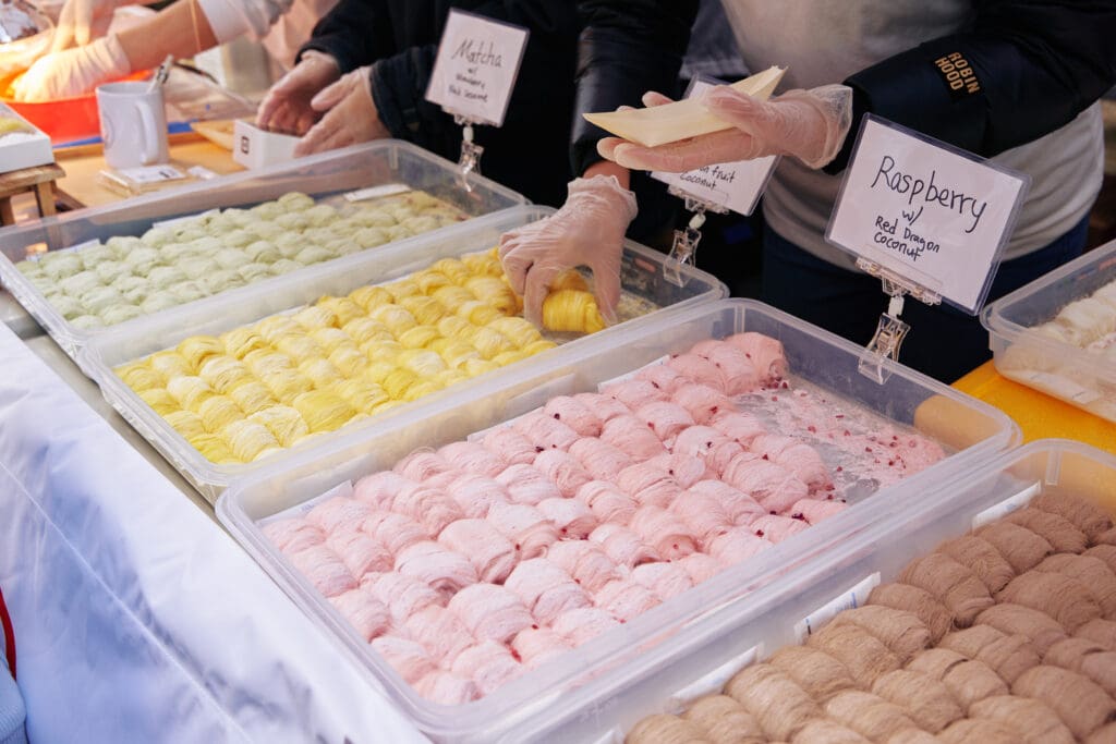 Bins of varied desserts (lemon, raspberry, chocolate, etc.) at Panda Fest in Phoenix. 