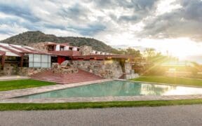 A sunrise view of Frank Lloyd Wright's Taliesin West Arizona winter home and pool.
