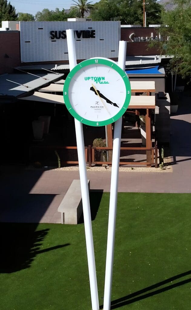 The new courtyard clock tower designed to honor and match the vintage-style pillars of Uptown Plaza's 2016 restoration.