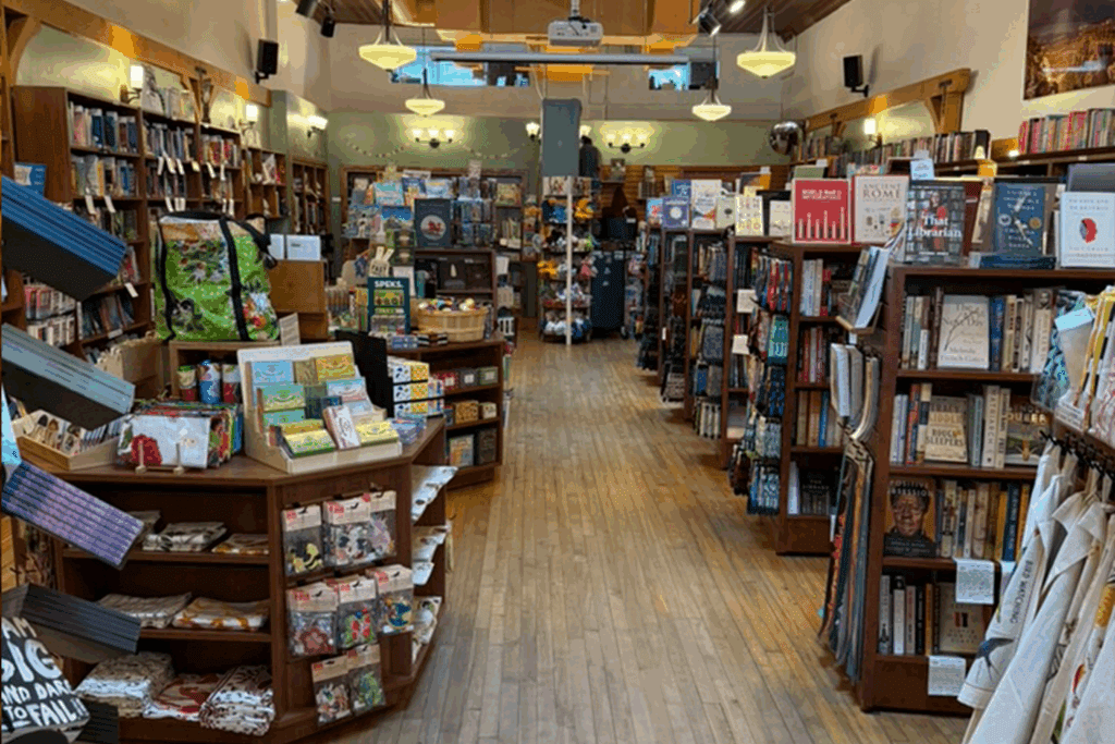 Free standing bookshelves and display shelves with books and novelty items fill Bright Side Bookshop in Flagstaff.