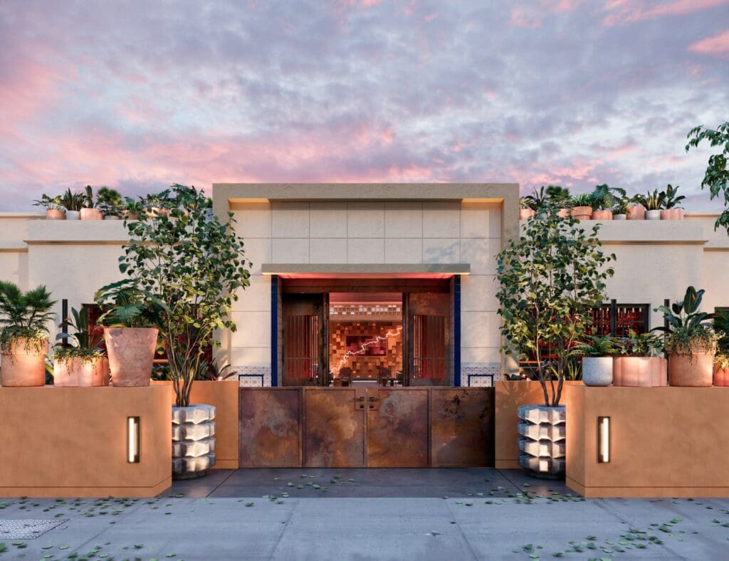 The outdoor Pablo's bar concept in Downtown Phoenix with a corrugated metal gate, adobe walls, plants and modern cube architecture.