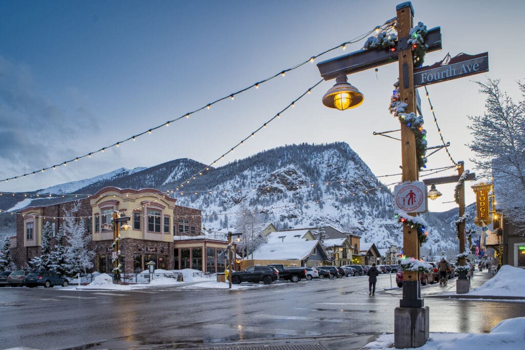 A snow-covered Downtown Frisco, Colorado is adorned with holiday decorations. 