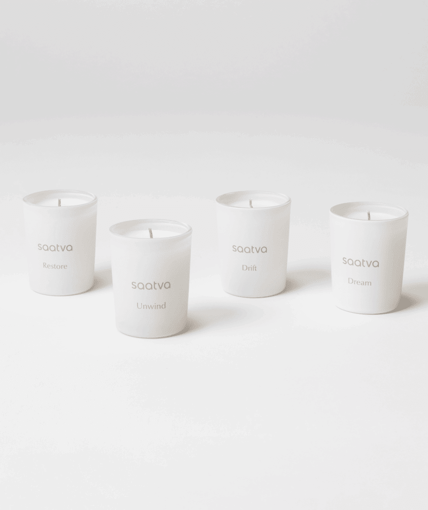 Four Saatva neutral-color bedside votive candle section created to promote sleep.