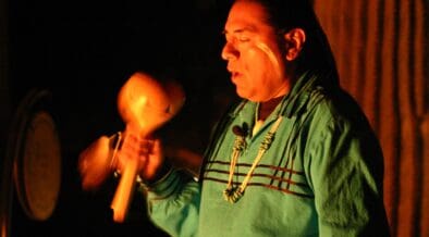 A member of the the Pima (Akimel O'otham) and Maricopa (Pee Posh) peoples plays a native instrument.