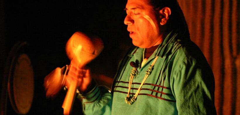 A member of the the Pima (Akimel O'otham) and Maricopa (Pee Posh) peoples plays a native instrument.