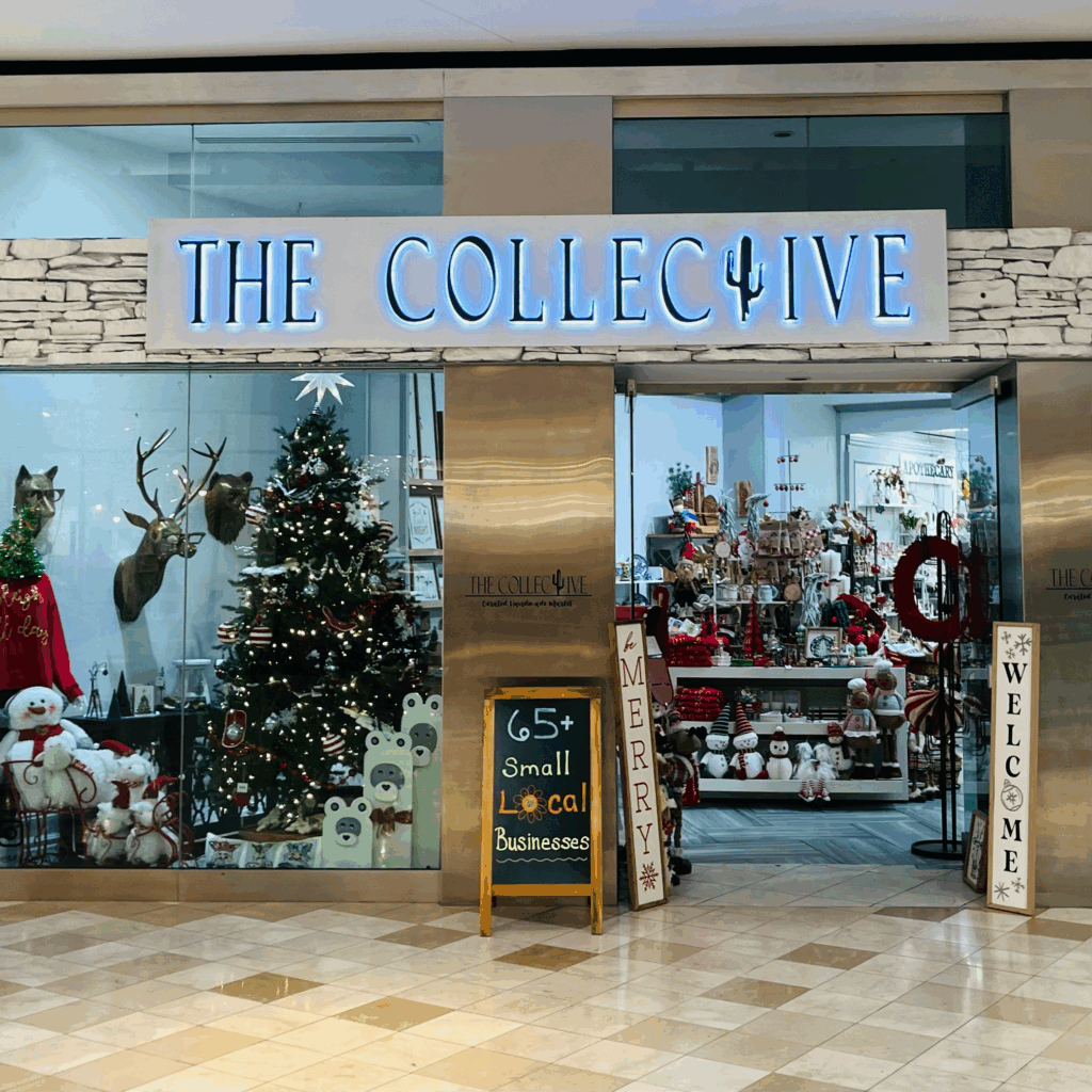 The Collective storefront with Christmas decor and artisan gifts inside at Chandler Fashion Center. 