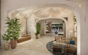 The lobby rendering of The Monarch San Antonio with modern seating, potted plants and decor.