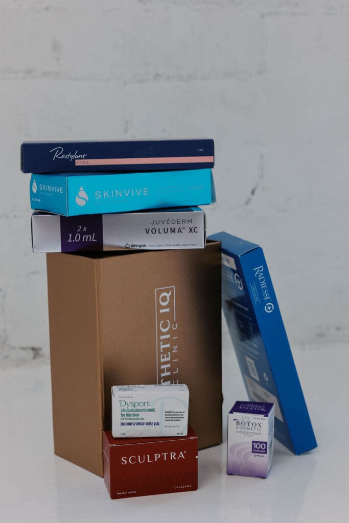 Several injectable products stacked together: Restylane, SkinVive, Jevederm, Disport, BOTOX, Sculptra and Radiesse at Aesthetics IQ in Scottsdale.