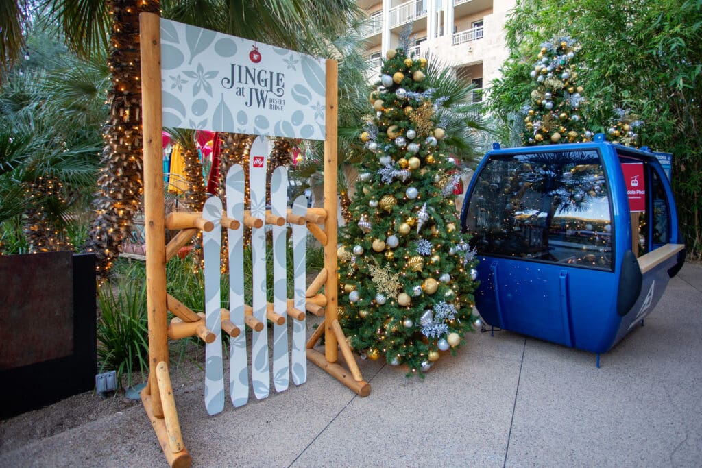 Christmas trees and a gondola carriage with other holiday decor at  JW Marriott Phoenix Desert Ridge Resort & Spa.