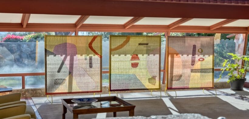 Three outdoor hanging panels in the Desert Mirror art display at Taliesin West.