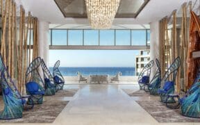 Open-air lobby at Garza Blanca Resort & Spa Los Cabos with ocean views and modern coastal design
