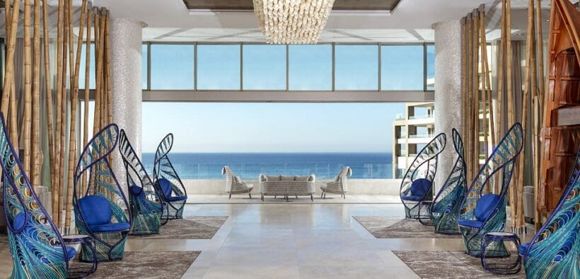 Open-air lobby at Garza Blanca Resort & Spa Los Cabos with ocean views and modern coastal design
