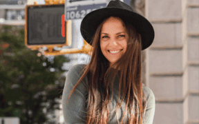 A photo of Hilary Sheinbaum, a New York–based author and journalist, wearing a hat in SoHo.
