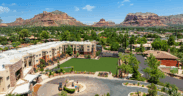 Aerial view of Hilton Sedona Resort at Bell Rock with red rock mountains and resort grounds in Sedona, Arizona.