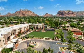 Aerial view of Hilton Sedona Resort at Bell Rock with red rock mountains and resort grounds in Sedona, Arizona.
