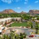 Aerial view of Hilton Sedona Resort at Bell Rock with red rock mountains and resort grounds in Sedona, Arizona.