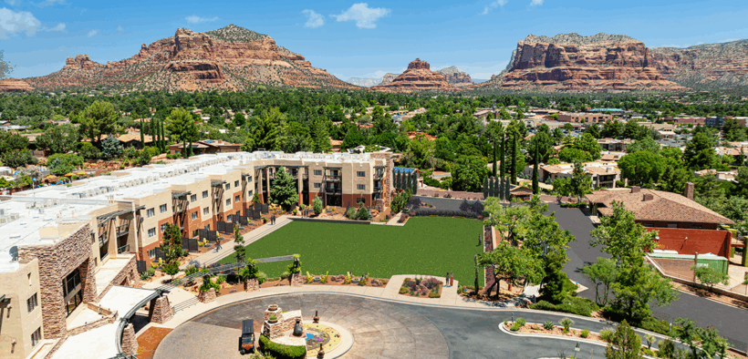 Aerial view of Hilton Sedona Resort at Bell Rock with red rock mountains and resort grounds in Sedona, Arizona.