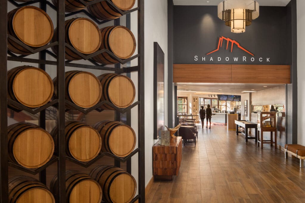 Lobby and ShadowRock Tap + Table entrance at Hilton Sedona Resort at Bell Rock, with stacked wine barrels.
